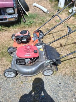 2 lawnmowers for parts