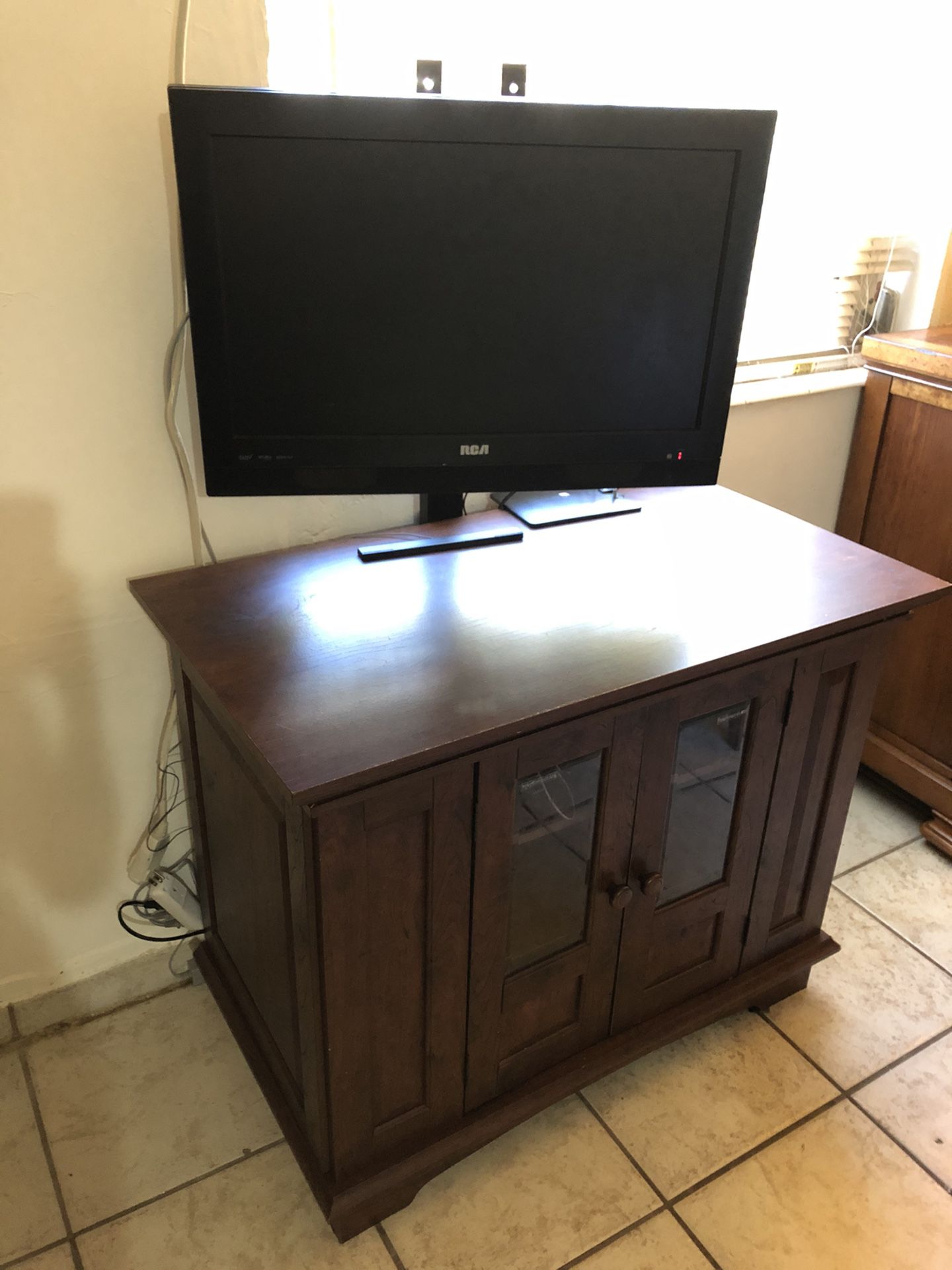 26” HDTV (RCA) has Internal DVD, comes with Cabinet Stand, 3 Shelves, 2 Hidden Compartments, Real Wood, Brown, Great Condition