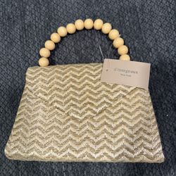 D'Margeaux New York straw clutch purse with wooden bead handles 
