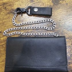 Brand new hand crafted genuine leather tri fold wallet with 24" stainless steel chain.

$75 FIRM