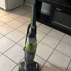 Bissell Green & Gray Vacuum and Steam Combo Cleaner.”