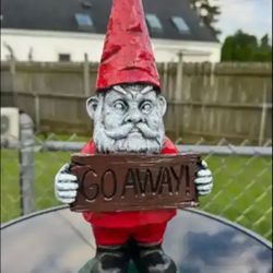 Gnome Holding Go Away Sign