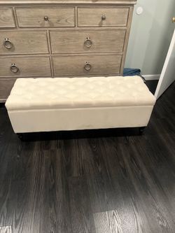 Beautiful cream ottoman with adequate space - perfect for storing clothes.