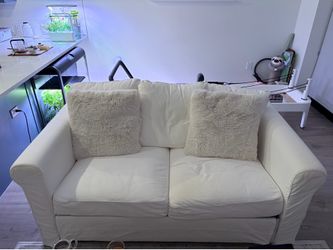 IKEA upland sofa with additional grey sofa cover