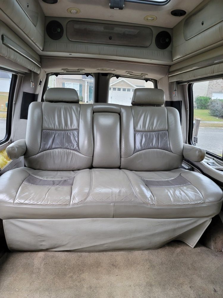 Photo Leather fully electric recliner to a bed will fit in any Conversion Van or camper tannish gray.