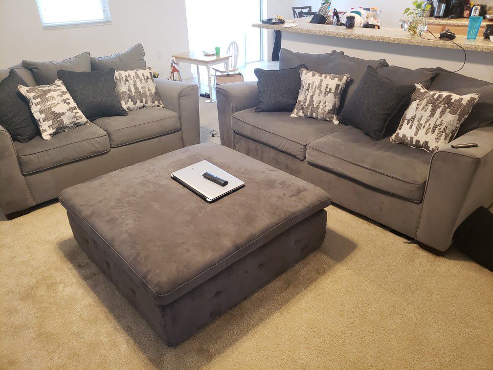 2 Suede couches with ottoman