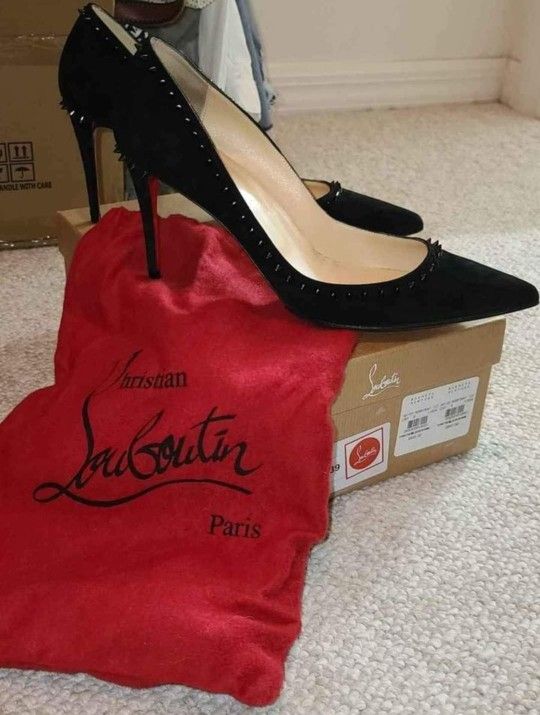 Women's black spiked Christian Louboutin heels. Size 9/39.