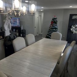 Gorgeous, sophisticated dining room table with six chairs.