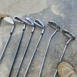 Golf clubs and baseballs