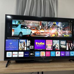 LG UHD Smart TV and TV stand