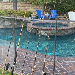 FIVE (5) Spinning Fishing Rods with Reels-some suitable for Saltwater Fishing and some Freshwater