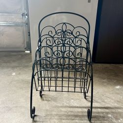 black wrought iron magazine rack