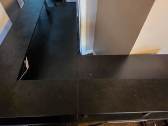 Black L shaped office desk with file cabinet charger port and plugs # 846
