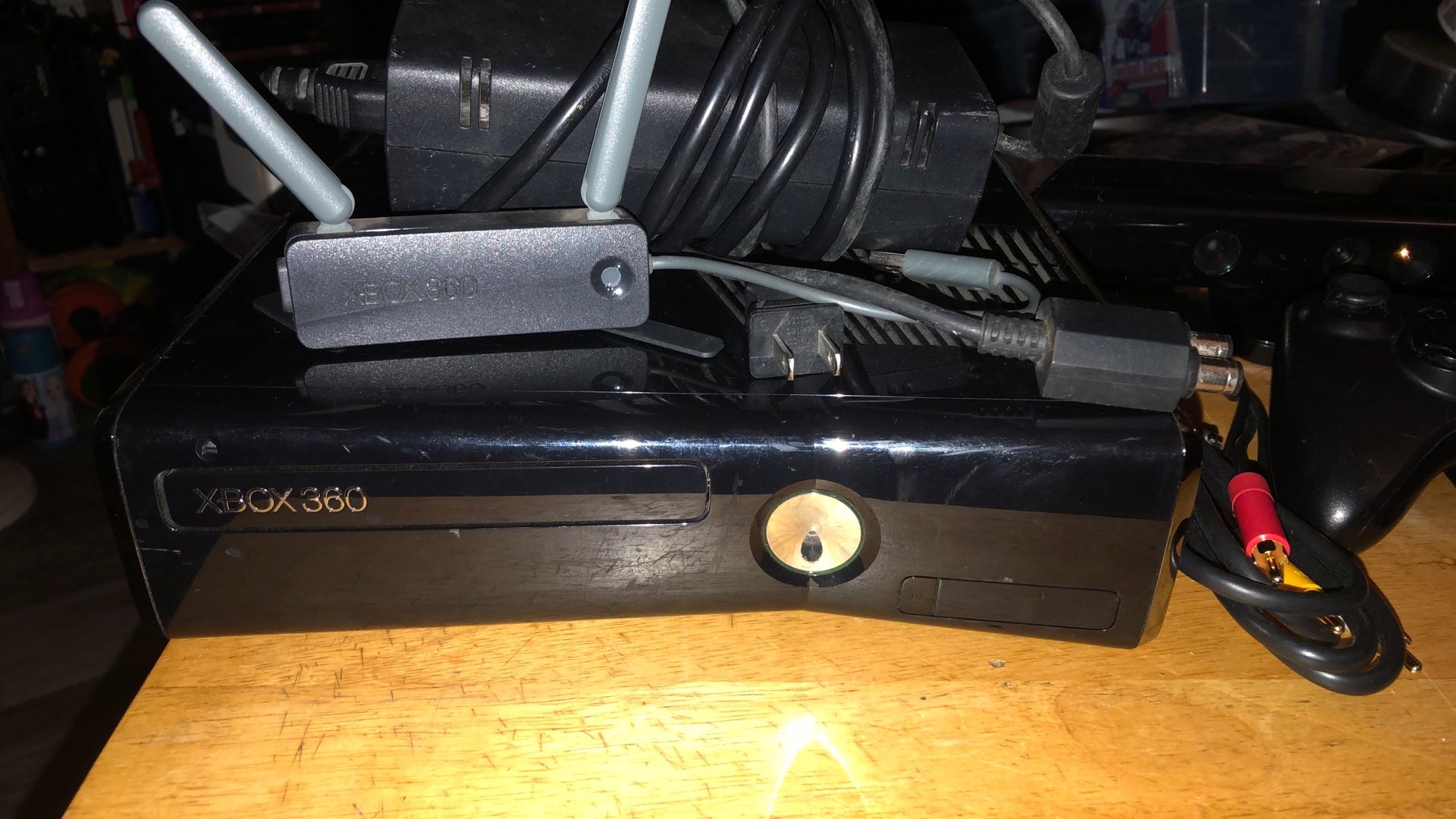 Xbox 360 S System With A One Wireless Controller And The Power Cable And RCA Cable And Two Sensors And One Game