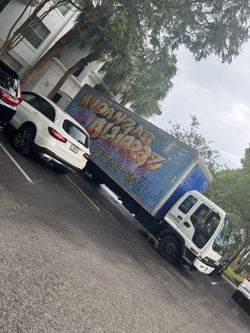 Mover Moving Boxes For Sale.  Men With Trucks