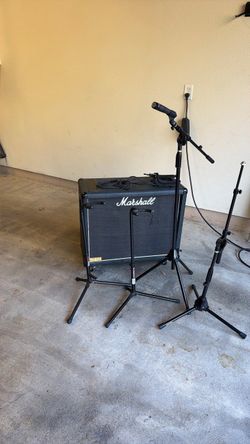 Marshall speaker cabinet, 2 microphone stands and 2 guitar stands
