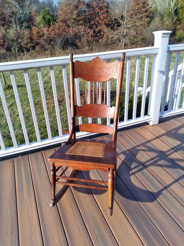Antique Carved Oak Pressed Back Cane Seat Rocking Chair