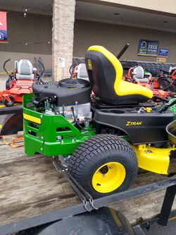 Riding zero turn mower