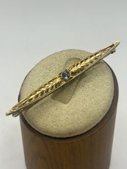 14k Yellow Gold Brooch Set With Sparkling Blue Stone