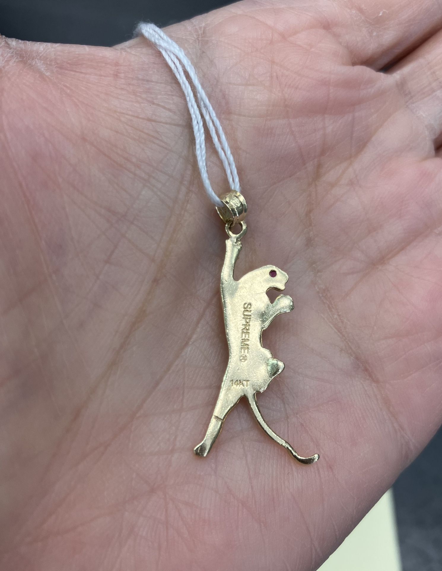 Supreme panther pendant discount