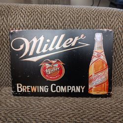 MILLER METAL SIGN.  12" X  8".  NEW. PICKUP ONLY