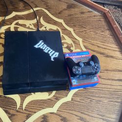 PS4 with controller + 4 games