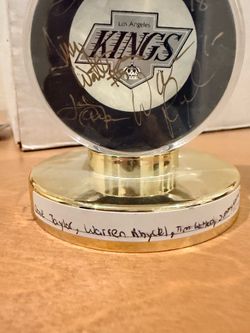 Dave Taylor, Warren Rychel, Tim Watters, and Jimmy Carson singed puck