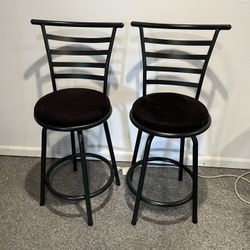 2 black swivel bar stools 24”