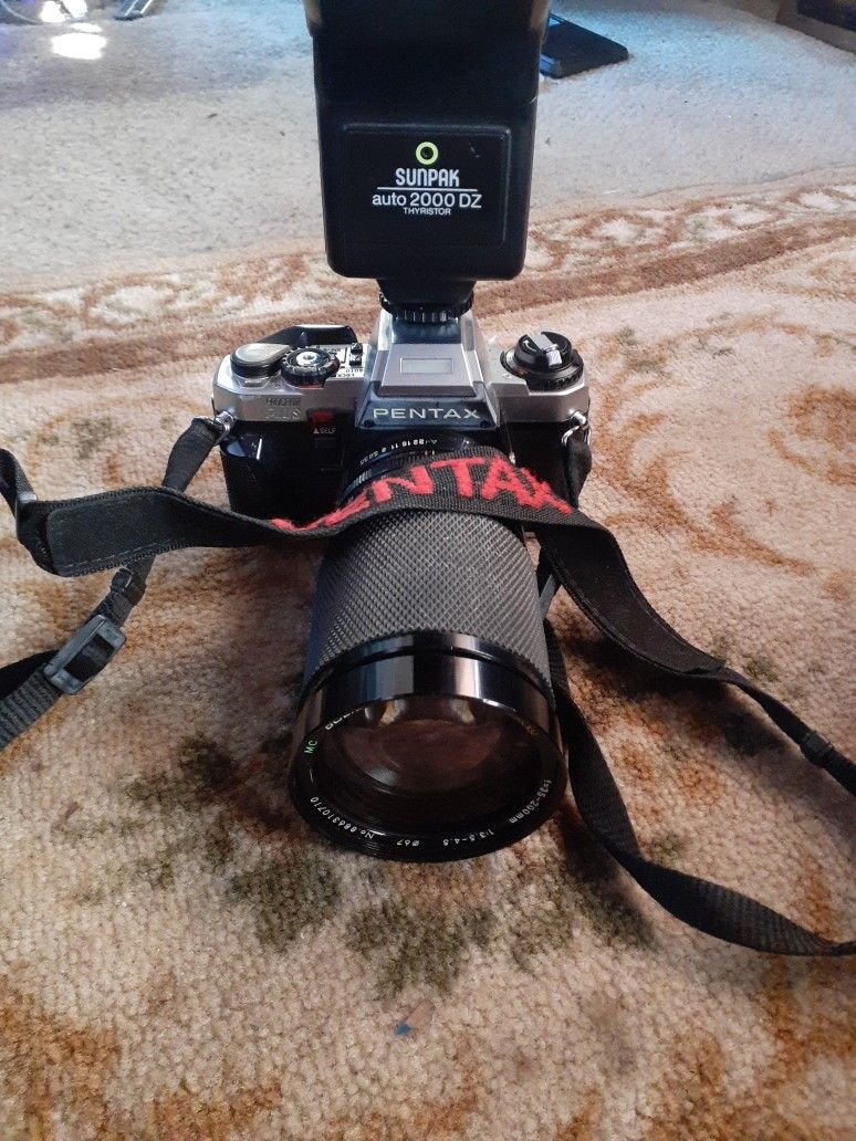 Pentax Program Plus 35mm Film Camera with Soligor Zoom Lens And Sunpak Flash