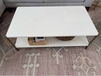 White two level coffee table with gold metallic legs