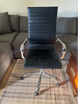 black faux leather and chrome high back executive office chair
