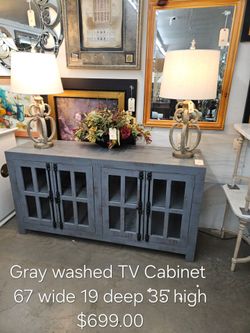 Gray Washed Wood TV Cabinet with Glass Doors We are located at 2811 East Bell road. Another Time Around Furniture.