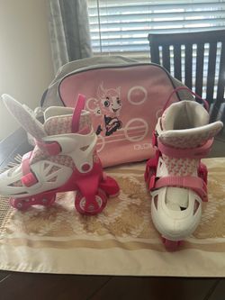 These WSJYP adjustable roller skates feature a pink and white design with a floral  pattern liner.