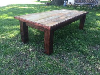 Smooth pallet wood coffee table with dark stained base.