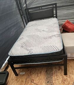 Twin metal bed frame with mattress