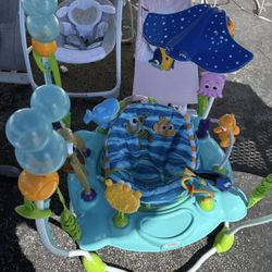 Bright Starts Disney Baby Finding Nemo Sea of Activities Baby Activity Center Jumper with Interactive Toys, Lights, Songs & Sounds
