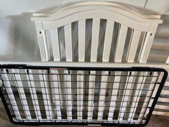 White wooden baby crib