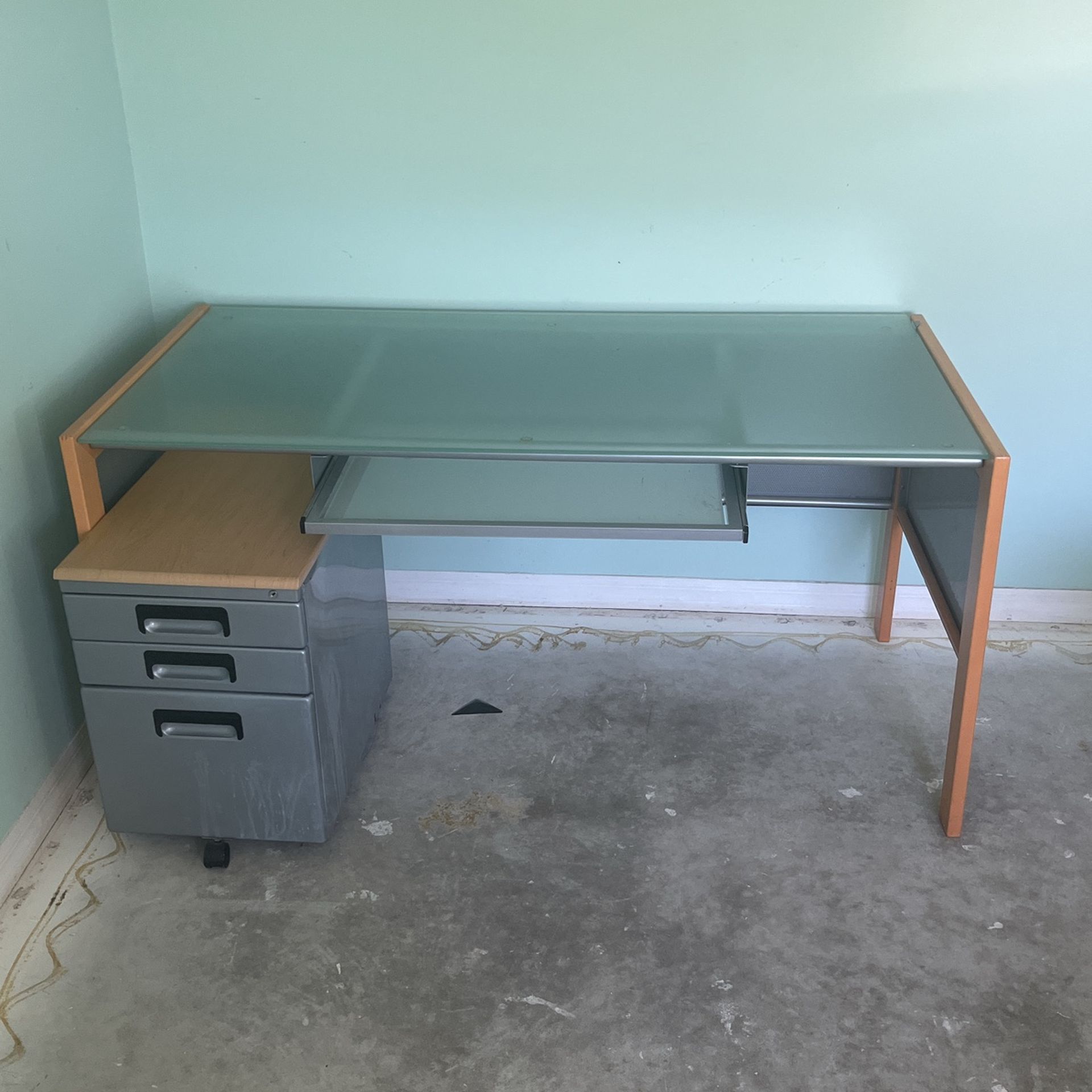 Glass Top Desk With Filing Cabinet $60.00 feet long 30 inches wide 29 inches tall
