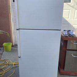 Whirlpool White Apartment Size Refrigerator 62” High X 28” Wide X 27  1/2” Deep