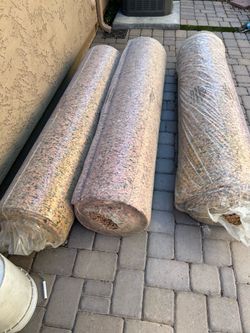 Three new rolls 3/8 inch carpet pad