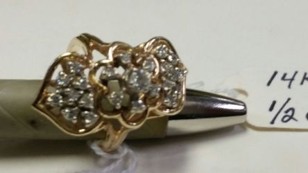 Size 6 half a carat genuine diamond 14 carat gold women's ring please do not place a bit unless you are ready to pick up