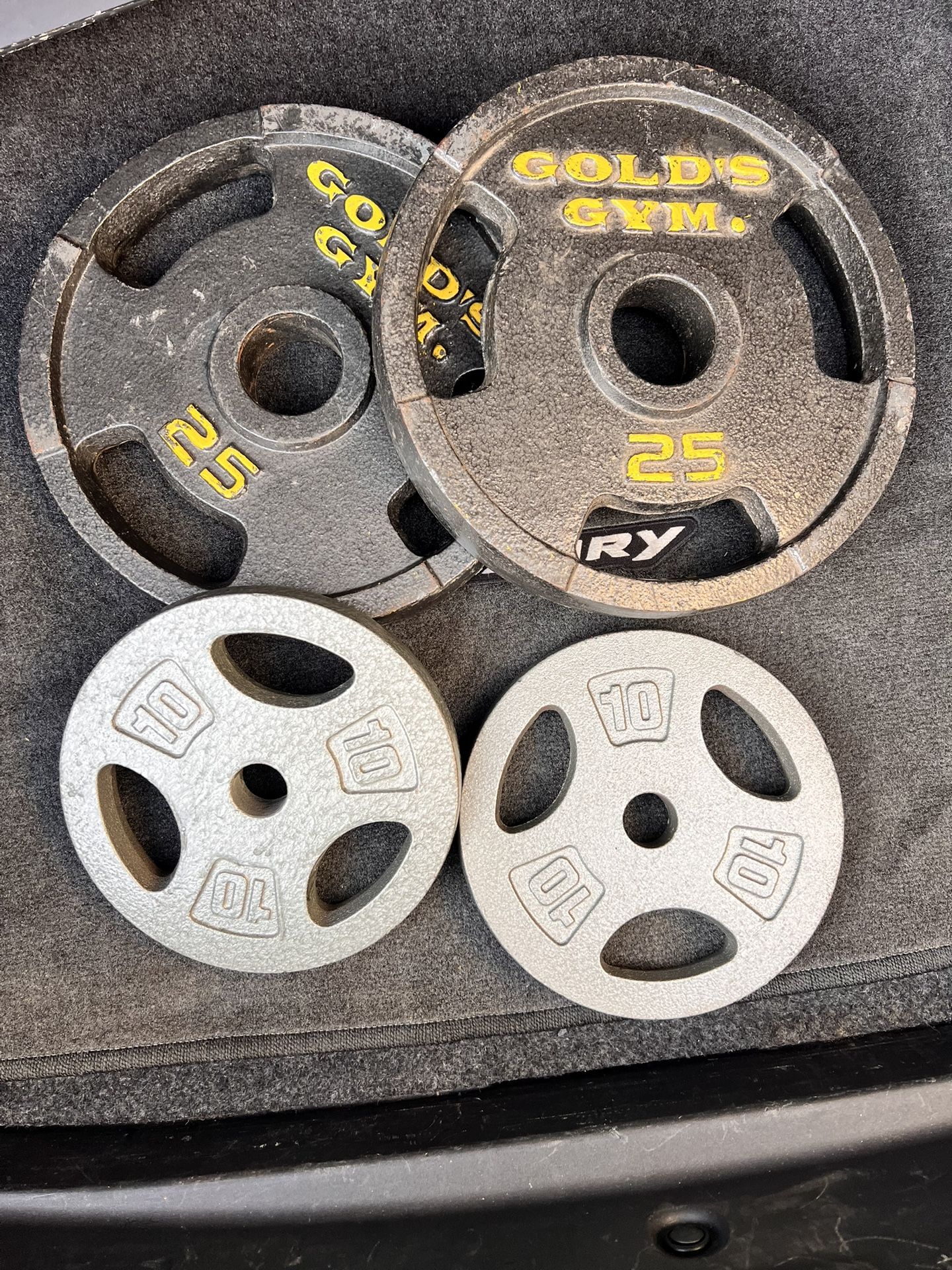 GOLD GYM SOLID PLATES ALL 4 FOR $75 OR MAKE ME AN OFFER.