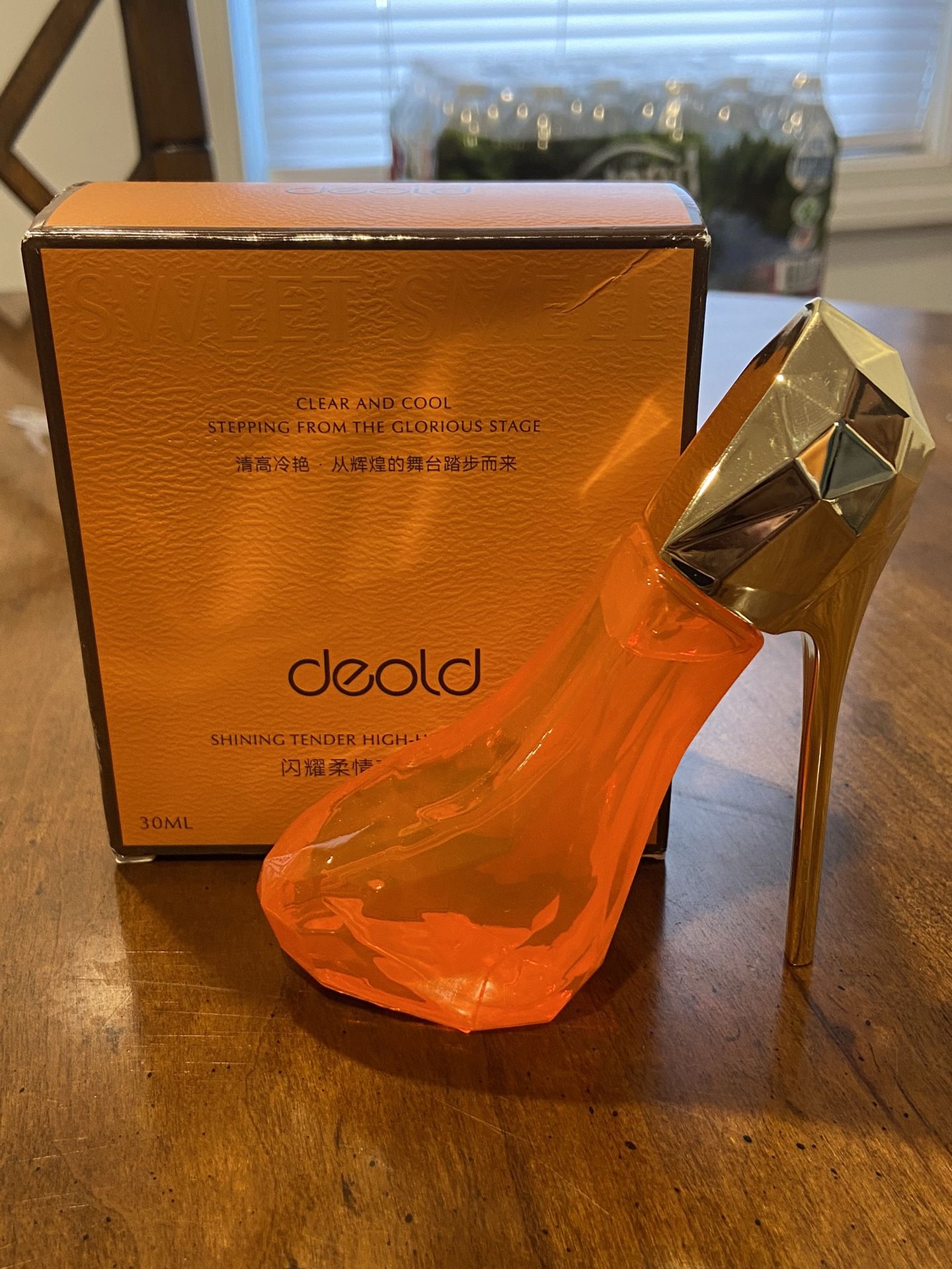 Orange high heel perfume