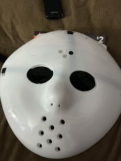 White plastic hockey mask that resembles the iconic style of Jason Voorhees from Friday the 13th.