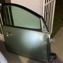 2004 through 2009 Toyota Prius Window and door panel and door handles and controller and motor to the window