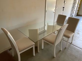 Modern dining table with 4 chairs. $125 OBO.  Cash Only
