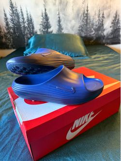 Blue Nike slides