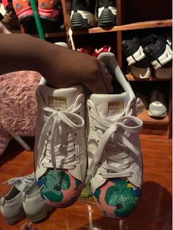 Adidas Superstars with multicolored floral design