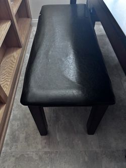 Table with 4 chairs and a bench