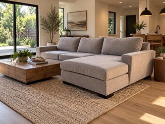 Grey living spaces sectional sofa - delivery available